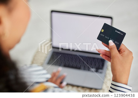 Credit card, laptop and woman doing online shopping, banking and online payment from her house. Ecommerce, retail and person reading information on a debit card to pay a store on the web with tech 123904438