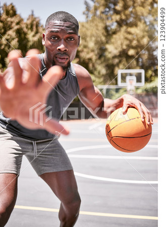 Portrait, sport and basketball black man on court in training, practice or game. Health, exercise and workout male athlete showing off skills, exercise for sports competition or tournament outdoor 123904499