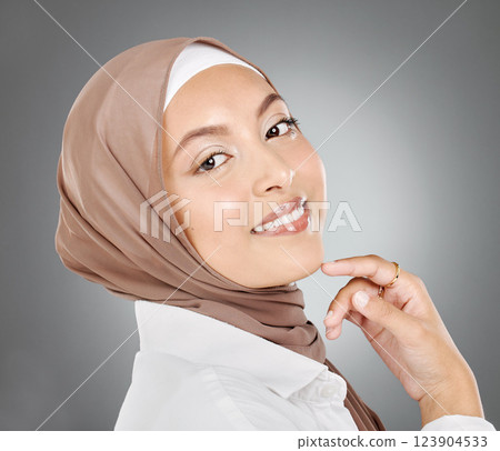 Muslim, arabic and woman beauty, skincare and makeup, aesthetic cosmetics or wellness on grey studio background. Happy islamic hijab face portrait, smile girl headshot or Saudi Arabia fashion culture 123904533
