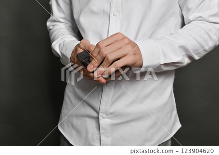 The wallet in his hands is a close-up. The concept The wallet in his hands is a close-up. The concept 123904620