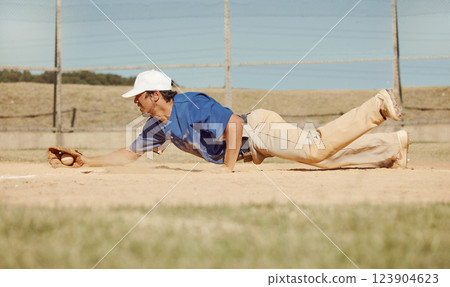 Sports, action and a man catching baseball, sliding in dust on floor with ball in baseball glove. Slide, dive and catch, baseball player on the ground during game, professional athlete on the field. Sports, action and a man catching baseball, sliding in dust on floor with ball in baseball glove. Slide, dive and catch, baseball player on the ground during game, professional athlete on the field. 123904623