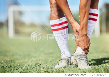 Soccer, sports and ankle pain, injury or accident on a field during a game, exercise or training. Muscle sprain, broken joint or medical emergency of a man athlete at a football pitch during a match. Soccer, sports and ankle pain, injury or accident on a field during a game, exercise or training. Muscle sprain, broken joint or medical emergency of a man athlete at a football pitch during a match. 123904723