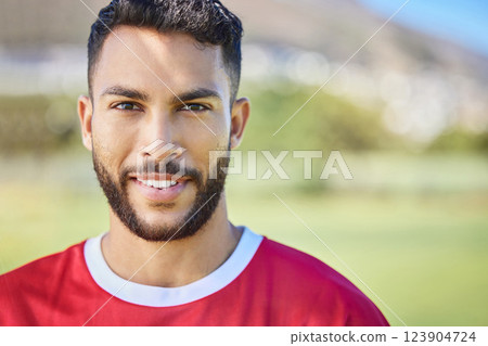Soccer player, portrait and man on soccer field happy, smile and excited about sports win at outdoor pitch. Indian football player, fitness and face of athlete guy at football training after workout 123904724