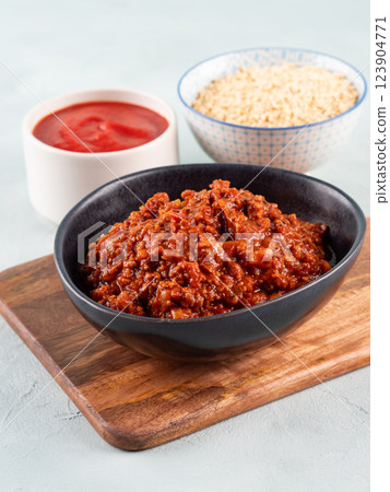 Vegan tomato bolognese ragu with soya protein granules in bowl 123904771