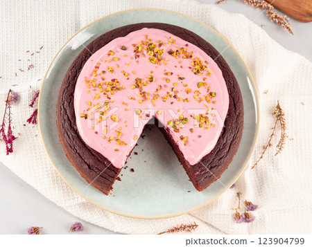 Beetroot chocolate cake with pink cream cheese pistachio icing Beetroot chocolate cake with pink cream cheese pistachio icing 123904799