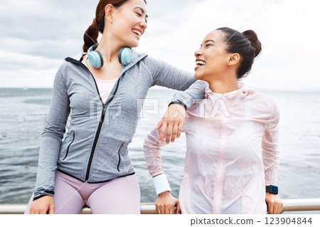 Fitness, sports and friends relax after beach workout training talking of health goals, body wellness and women support. Gen z runner people in conversation together for exercise sea or ocean mock up Fitness, sports and friends relax after beach workout training talking of health goals, body wellness and women support. Gen z runner people in conversation together for exercise sea or ocean mock up 123904844