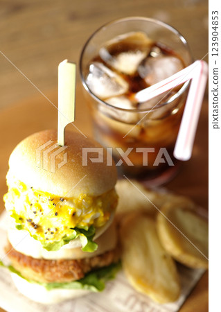 Egg and croquette mini hamburger with fries and cola 123904853