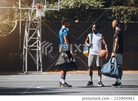 Basketball, sport and men planning game, training and exercise on a court together. Happy, smile and African friends and team talking before fitness, sports or cardio workout for competition 123904961