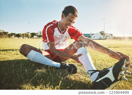Soccer, athlete and injury on sport field while exercise, workout and practice suffer on game day. Football, health and painful leg from training, sore or muscle for stretching, fallen or foot pain Soccer, athlete and injury on sport field while exercise, workout and practice suffer on game day. Football, health and painful leg from training, sore or muscle for stretching, fallen or foot pain 123904999