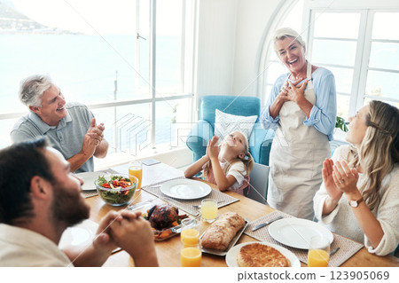 Family, lunch and happy, applause for food and drink, thank you and together in family home in Australia. Grandparents, parents and child eating, nutrition and spending quality time together 123905069