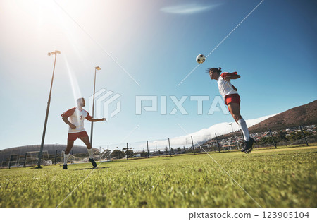 Man, soccer and team in sports training, exercise and workout for fitness on the field in the outdoors. Athletic men playing in football with head trick in healthy sport practice together on grass Man, soccer and team in sports training, exercise and workout for fitness on the field in the outdoors. Athletic men playing in football with head trick in healthy sport practice together on grass 123905104