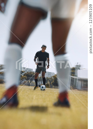 Soccer, sports man and team legs in game training on field while, running, passing and kick ball outdoors. Cardio health, active fitness and fast soccer player in football workout on sport pitch 123905109