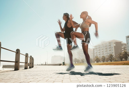 City fitness, woman or man jumping in cardio exercise, workout or training for hearth health, speed or coordination. Sports people, runner friends or couple and energy in high knees wellness warm up City fitness, woman or man jumping in cardio exercise, workout or training for hearth health, speed or coordination. Sports people, runner friends or couple and energy in high knees wellness warm up 123905126
