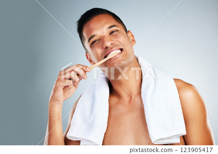 Dental, health and man use toothbrush and toothpaste to clean teeth for healthy mouth, gums and happy. Confident, male and relax shows oral hygiene with big smile, cleaning and brushing teeth 123905417