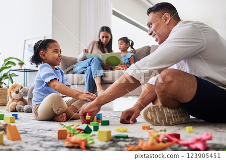Learning, education and family play with blocks with father and creative daughter playing together in living room. Childhood, development or parent, mother or mom reading story book to girl on sofa 123905451
