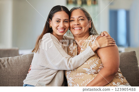 Woman, happy and hug of a mother and adult child on a home living room lounge couch with love. Portrait of people from Mexico smile on a house sofa with care, happiness and quality time together Woman, happy and hug of a mother and adult child on a home living room lounge couch with love. Portrait of people from Mexico smile on a house sofa with care, happiness and quality time together 123905488