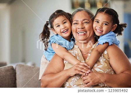 Relax, smile and grandma with children on sofa for family, happy and love together. Retirement, hug and wellness with portrait of old woman and kids in living room for lifestyle, mothers day and care 123905492