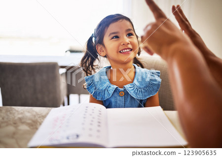 Education, homeschool and a kindergarten girl with smile, notebook and help from mother in math class. Home school, happy child and learning to count on fingers and hands, woman teaching kid maths. 123905635