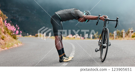 Sports man, stretch and cycling break along mountain route by cyclist resting during fitness, exercise and morning cardio. Stretching, bicycle and black man stop for rest during physical performance Sports man, stretch and cycling break along mountain route by cyclist resting during fitness, exercise and morning cardio. Stretching, bicycle and black man stop for rest during physical performance 123905651
