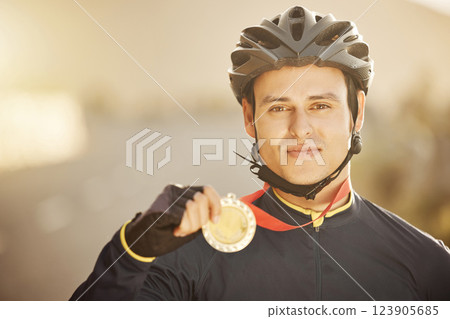Cycling, helmet and medal with a sports man after a race as a winner, champion or medalist outside. Motivation, celebration and win with a young male athlete proud of reaching a target or goal Cycling, helmet and medal with a sports man after a race as a winner, champion or medalist outside. Motivation, celebration and win with a young male athlete proud of reaching a target or goal 123905685