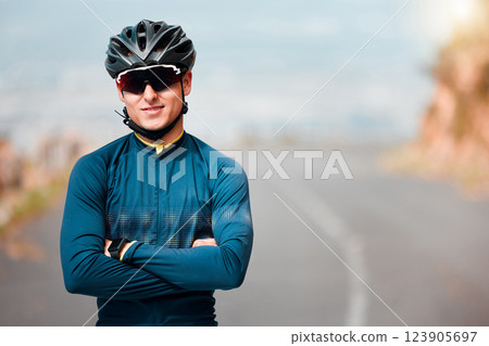 Sports man, vision and cycling success by cyclist on mountain route road with arms folded, power and health. Fitness, sport and performance goal by guy athlete looking proud, ready and strong mindset 123905697