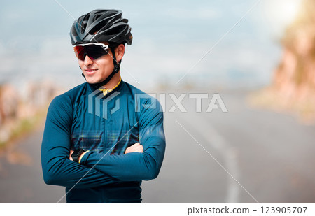 Cycling, cyclist or sports man, arms crossed and ready to cycle, ride or exercise on road. Health, wellness and happy male athlete from Canada preparing for workout, fitness or training outdoors. 123905707