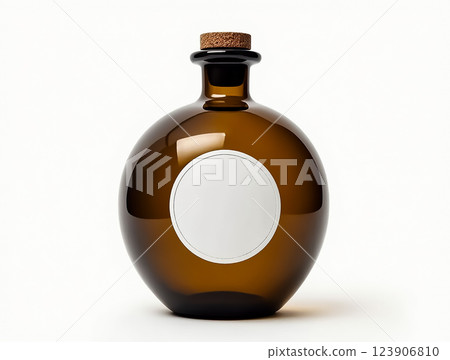 Elegant amber glass bottle with a cork top and blank label for custom branding or gifts 123906810