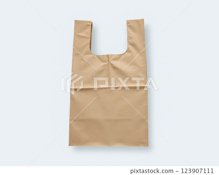 Simple brown shopping bag designed for carrying groceries or other items with a cutout handle 123907111