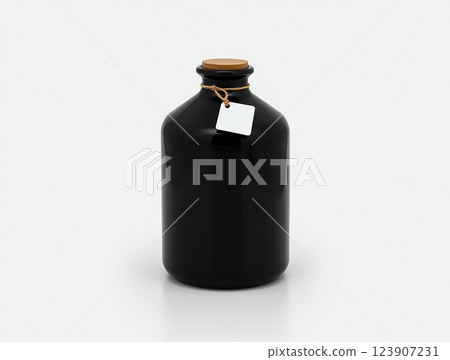 Elegant black glass bottle with cork lid on a minimalist background showcasing simple design and style 123907231