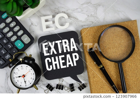 EC - Extra Cheap acronym with calculator, alarm clock and magnifying glass, business concept background EC - Extra Cheap acronym with calculator, alarm clock and magnifying glass, business concept background 123907966