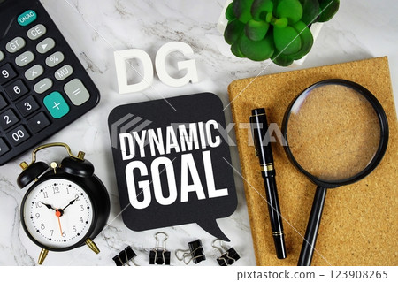 DG - Dynamic Goal acronym with calculator, alarm clock and magnifying glass, Business concept background 123908265