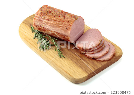 Sliced ham with rosemary on a cutting board. Sliced ham with rosemary on a cutting board. 123908475