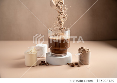 Chocolate protein powder pouring in a glass. Food supplement, fitness sport, health and nutrition. 123908489