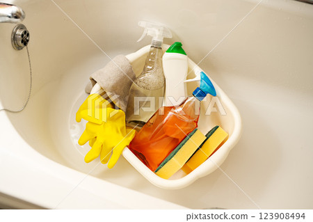 Home bathroom toilet cleaning concept. Bottles of cleaning products, sponges and rubber gloves. 123908494