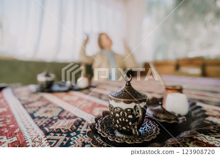 Intricate Turkish Coffee Set on a Colorful Rug Intricate Turkish Coffee Set on a Colorful Rug 123908720