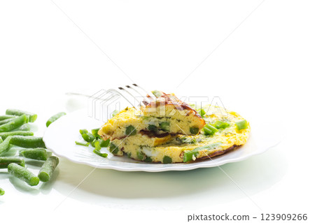 Egg omelette with herbs and vegetables isolated on white background Egg omelette with herbs and vegetables isolated on white background 123909266