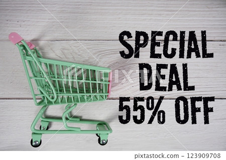 Special Deal 55% off and trolley shopping cart on wooden background 123909708