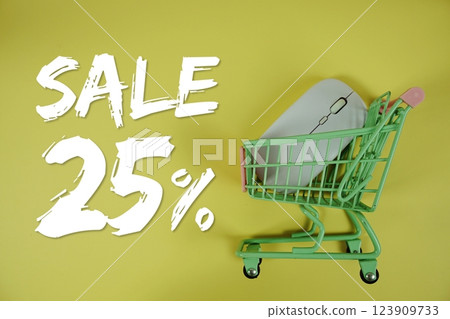 Sale 25% Special Discount shopping online with trolley shopping cart and optical mouse on yellow background Sale 25% Special Discount shopping online with trolley shopping cart and optical mouse on yellow background 123909733