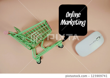 Online Marketing text on speech bubble with optical mouse and trolley shopping cart on pink background Online Marketing text on speech bubble with optical mouse and trolley shopping cart on pink background 123909741