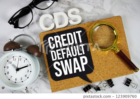 CDS - Credit Default Swap acronym with alarm clock and magnifying glass, Business concept background 123909760
