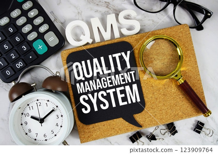 QMS - Quality Management System acronym with calculator, alarm clock and magnifying glass, business concept background QMS - Quality Management System acronym with calculator, alarm clock and magnifying glass, business concept background 123909764