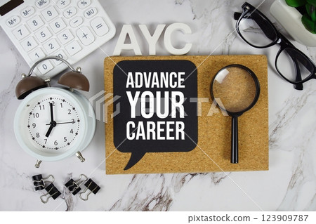 AYC - Advance Your Career acronym with calculator, alarm clock and magnifying glass, business concept background AYC - Advance Your Career acronym with calculator, alarm clock and magnifying glass, business concept background 123909787
