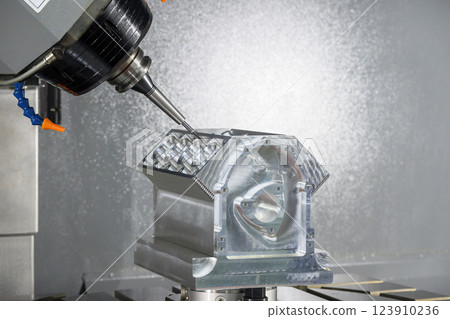 The 5-axis CNC milling machine cutting the aluminum engine block by solid ball nose end mill tool. 123910236