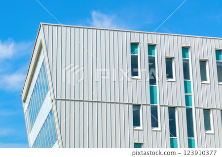 Office building with geometric design in the downtown area of the city. Office building with geometric design in the downtown area of the city. 123910377