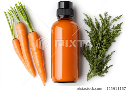 Carrot juice bottle with fresh carrots and leaves lying on white background 123911167