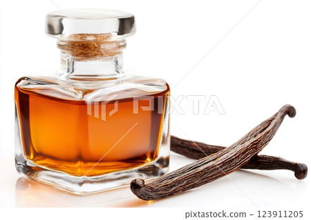 Vanilla extract in a glass bottle with two vanilla pods 123911205