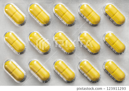 Pack of yellow pills Pack of yellow pills 123911293