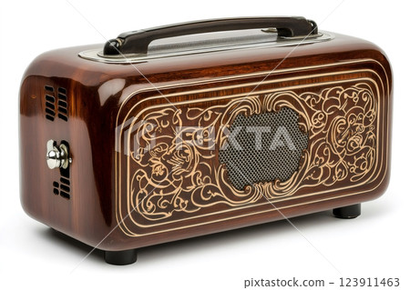 Vintage radio receiver featuring intricate wooden carvings and a classic design 123911463