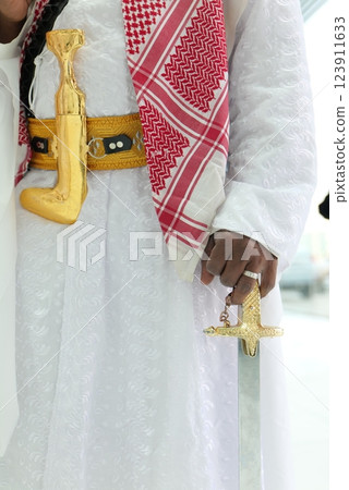 Traditional Saudi Arabian Warrior - Attire Jambiya and Sword 123911633