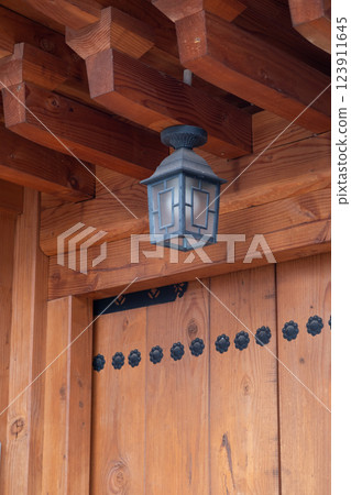 Light bulb in the lamp, at the entrance of Korean traditional house 123911645
